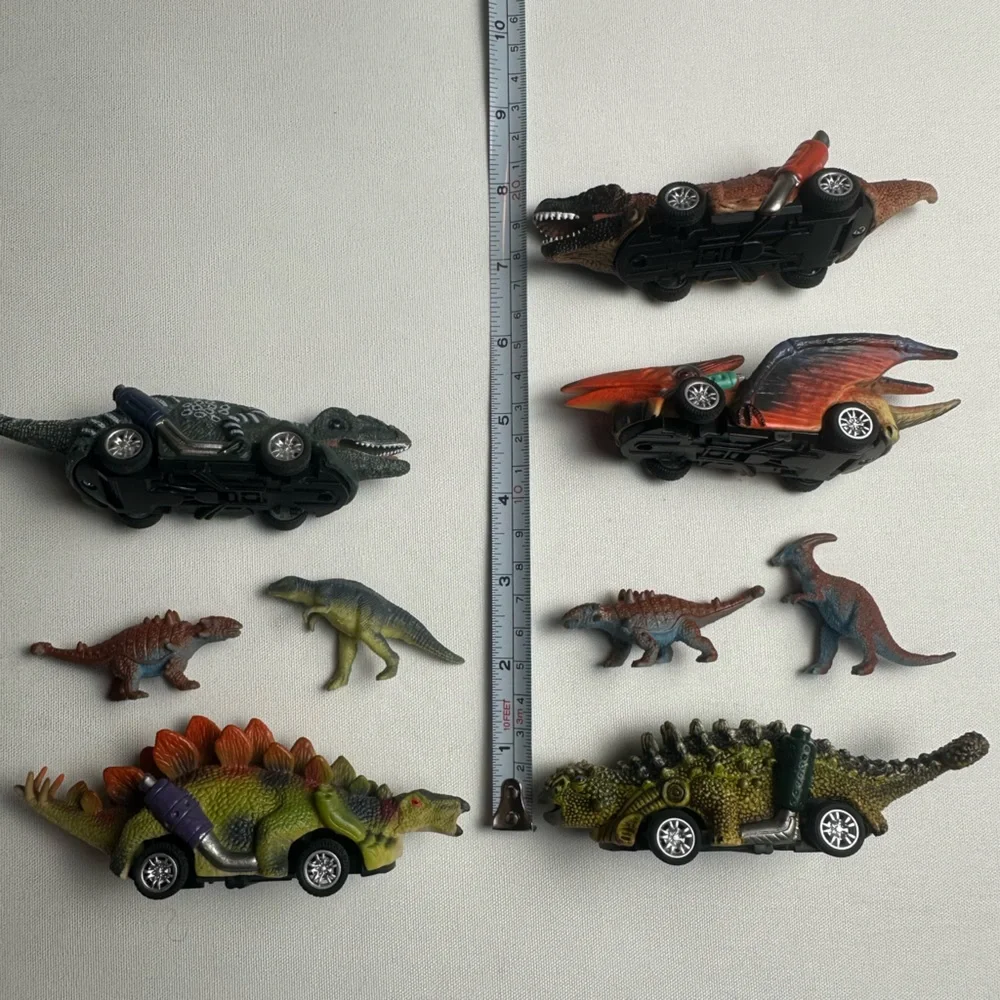 Bundle of multiple sized dinosaurs. 5 are wind up cars. See video.